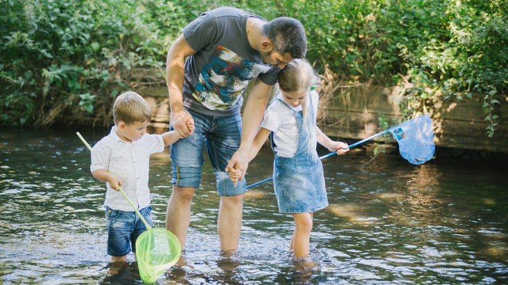 Pond dipping in the River Wandle at Morden Hall Park, London